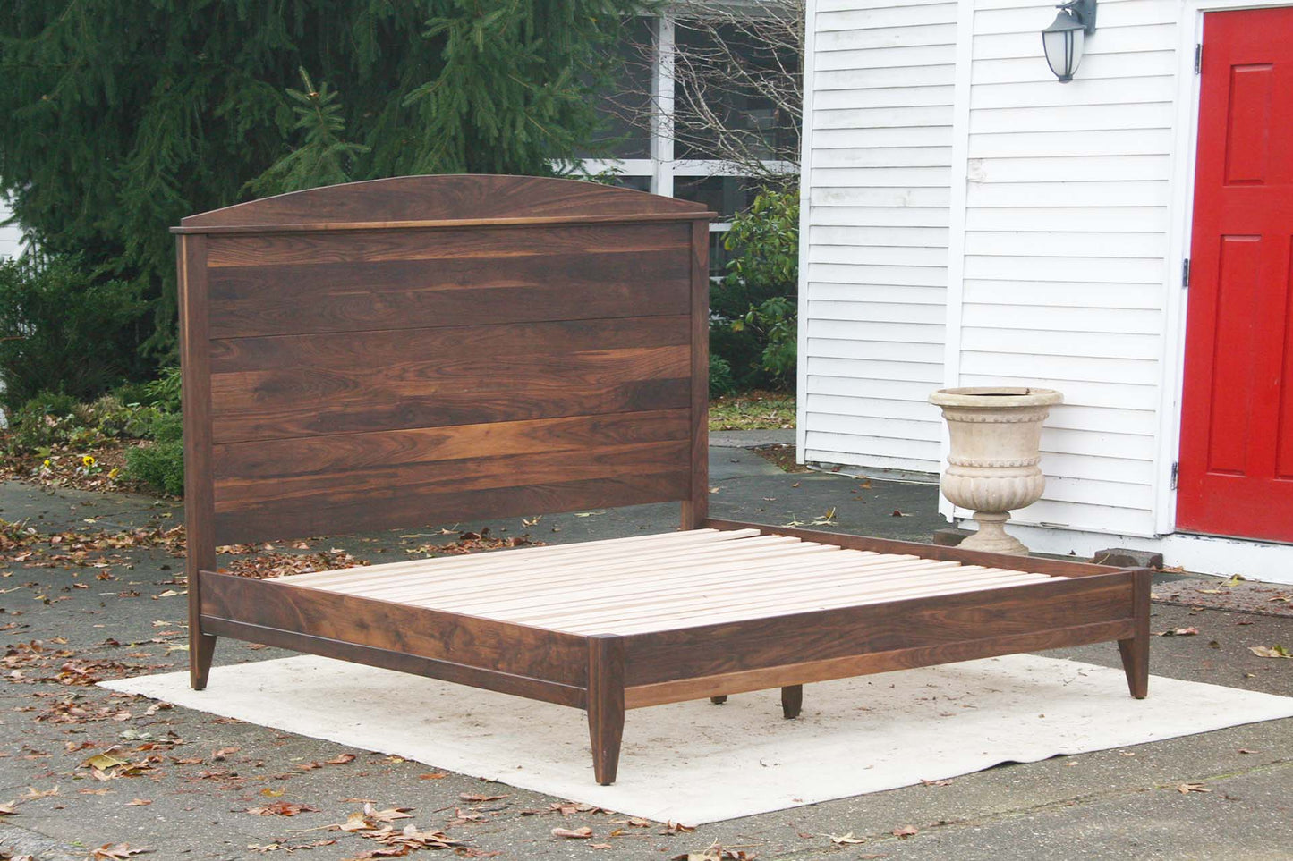 Platform bed with tall headboard side view