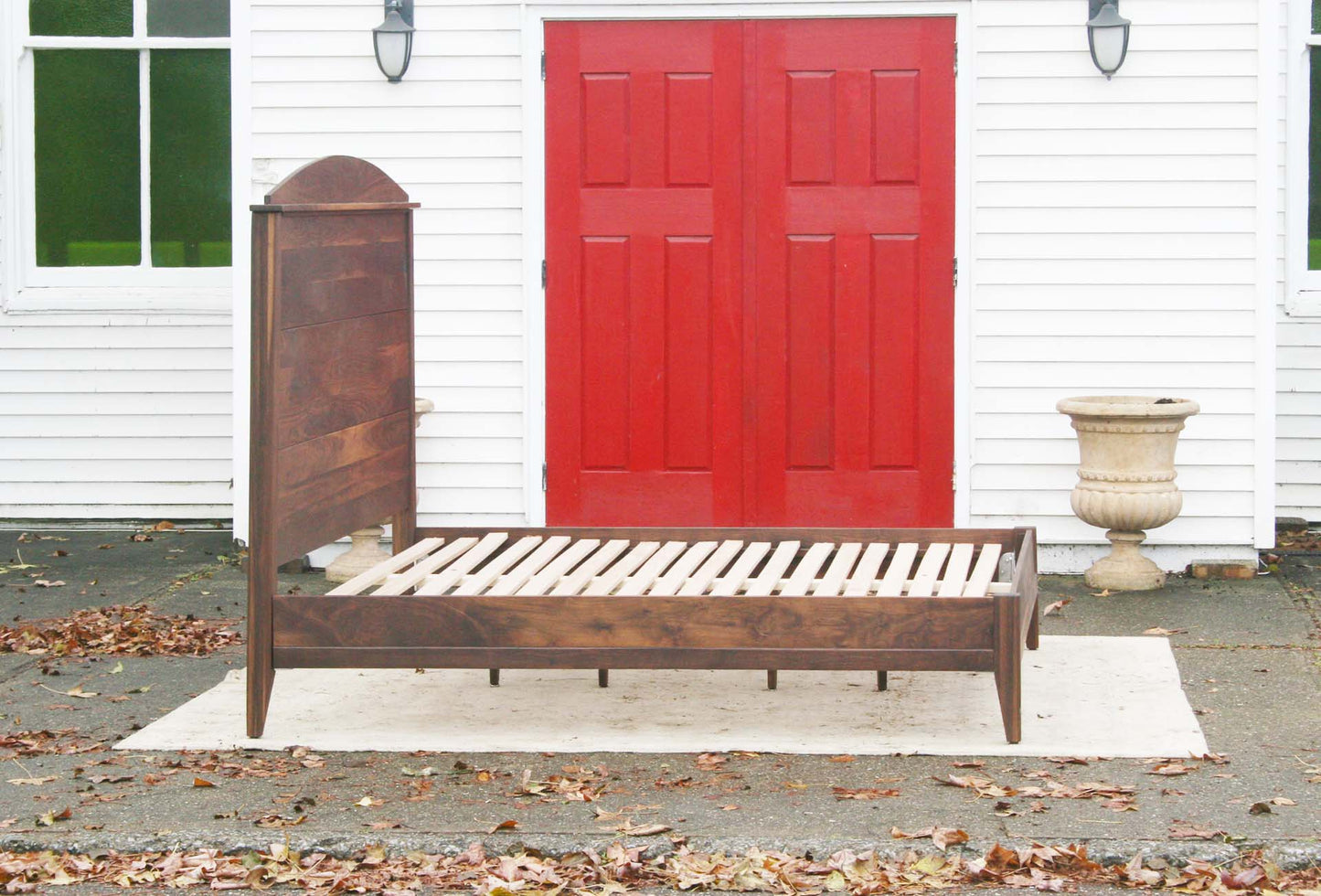 side view platform bed with tall arched headboard