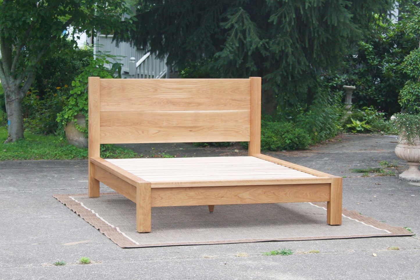 platform bed with thick posts and vertical headboard