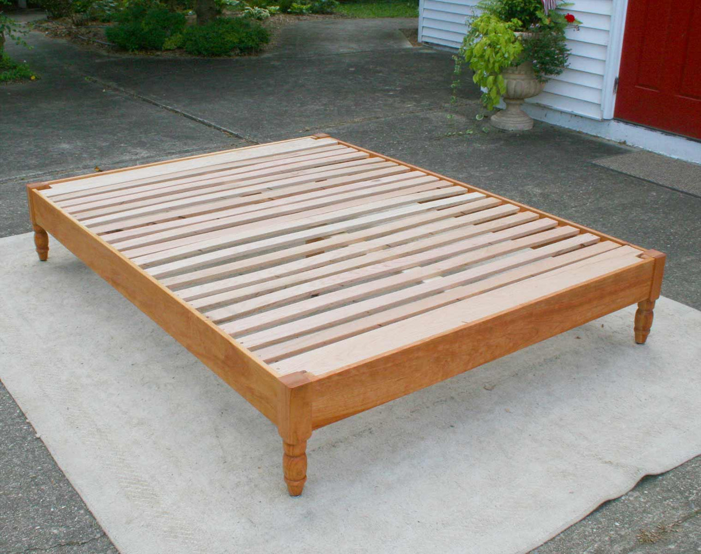 angled view platform bed with turned corner posts