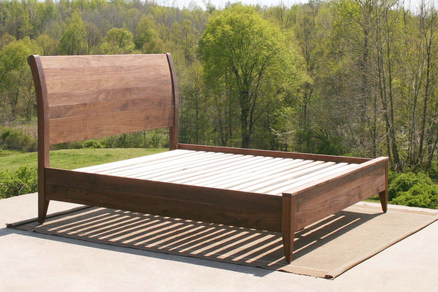 side view walnut sleigh bed