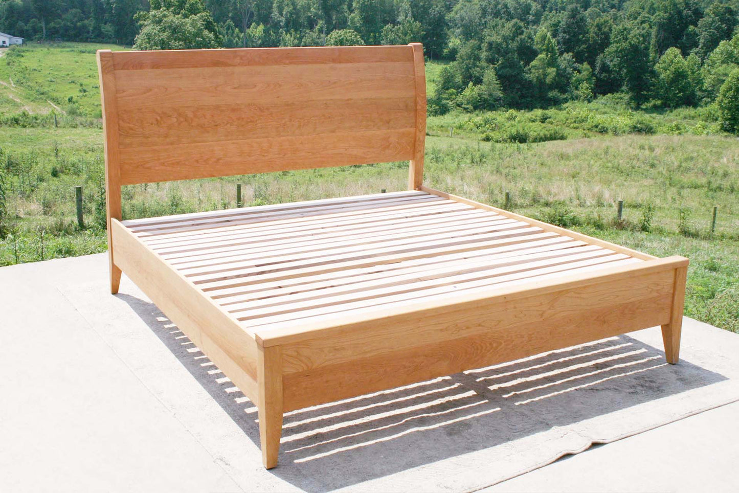 angled view cherry sleigh bed