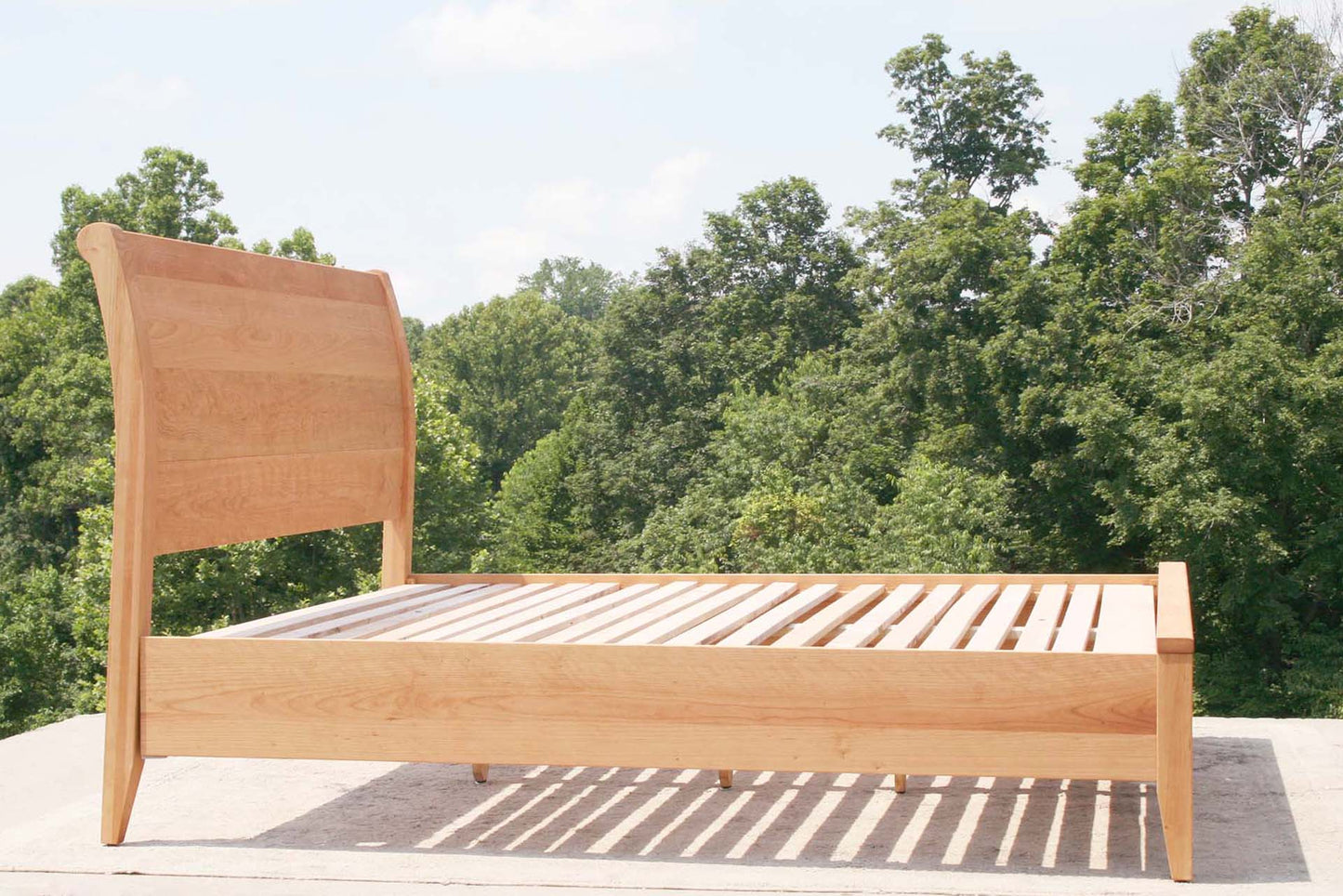cherry sleigh bed side view