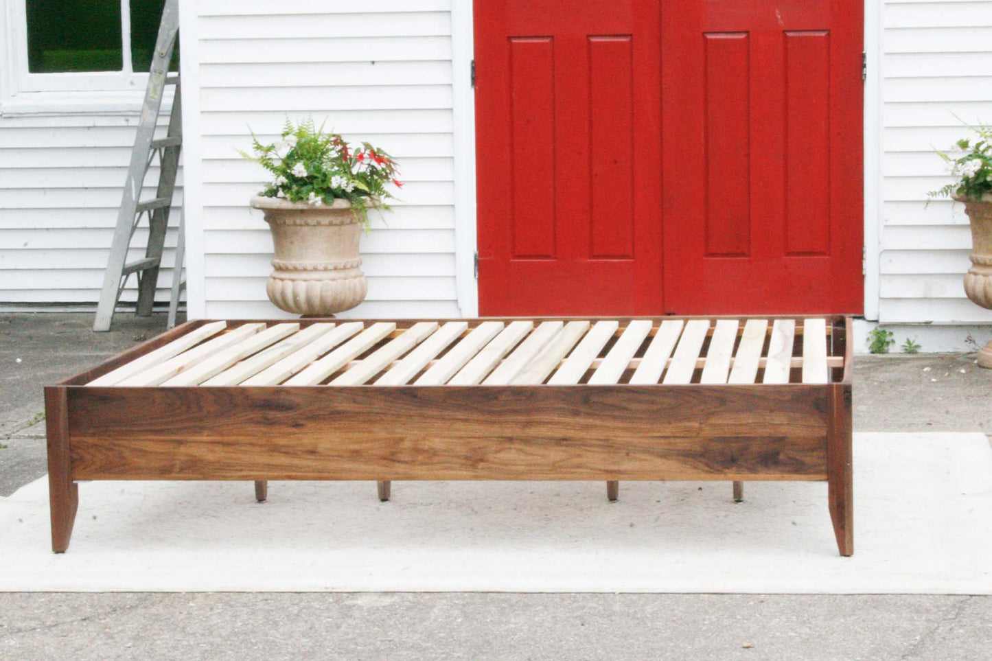 walnut storage bed with 6 drawers and angled headboard