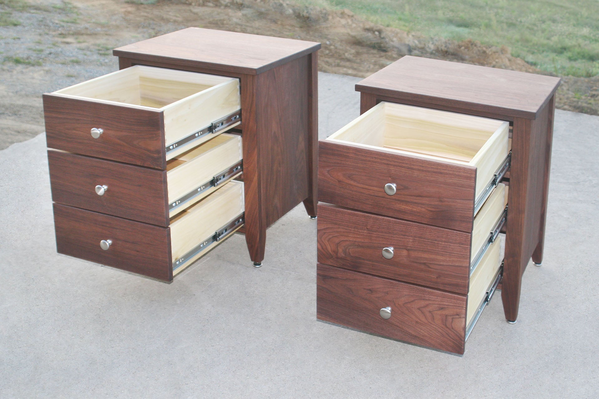 night stand set in walnut with three drawers open