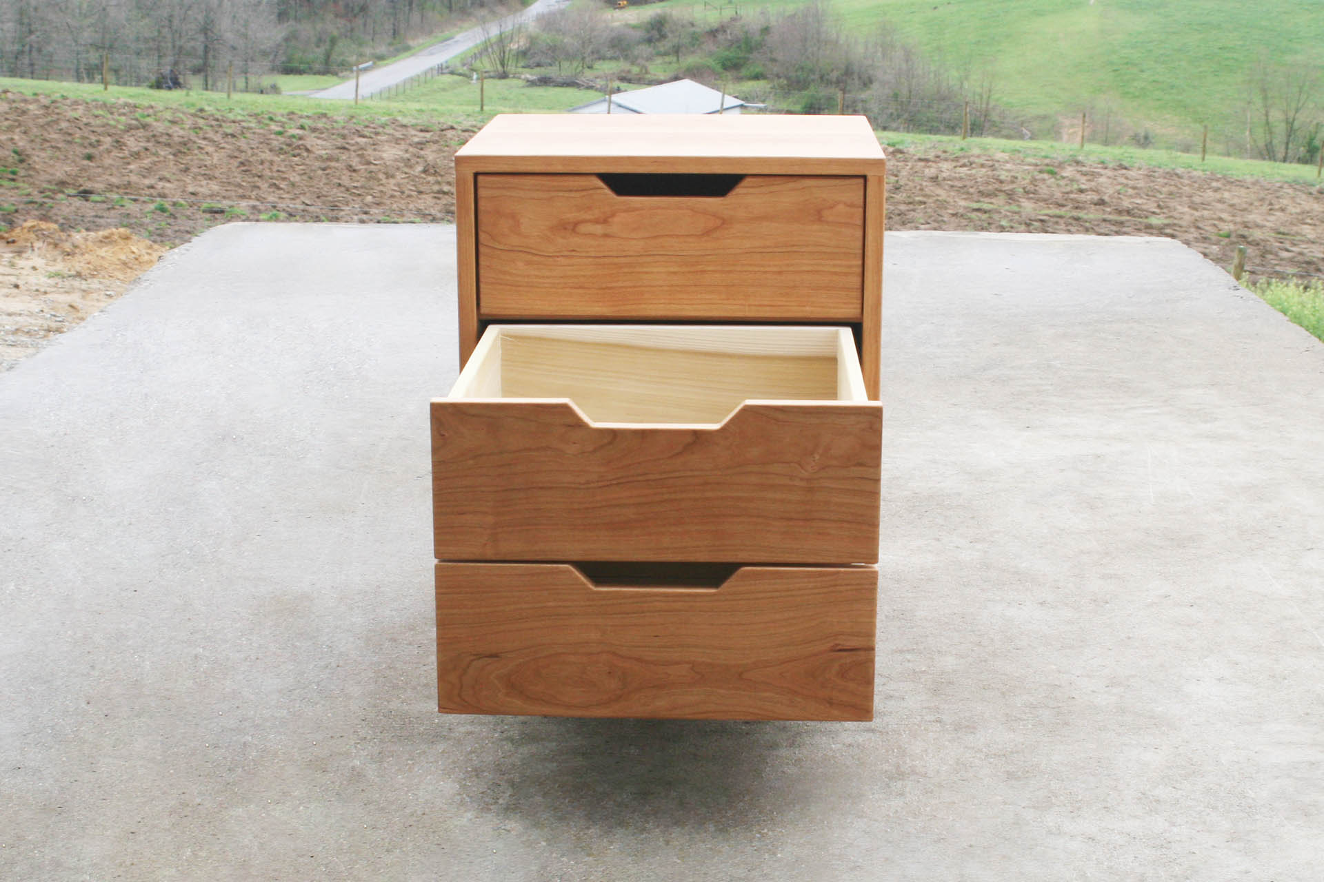 Three drawer nightstand with lower drawers open front view