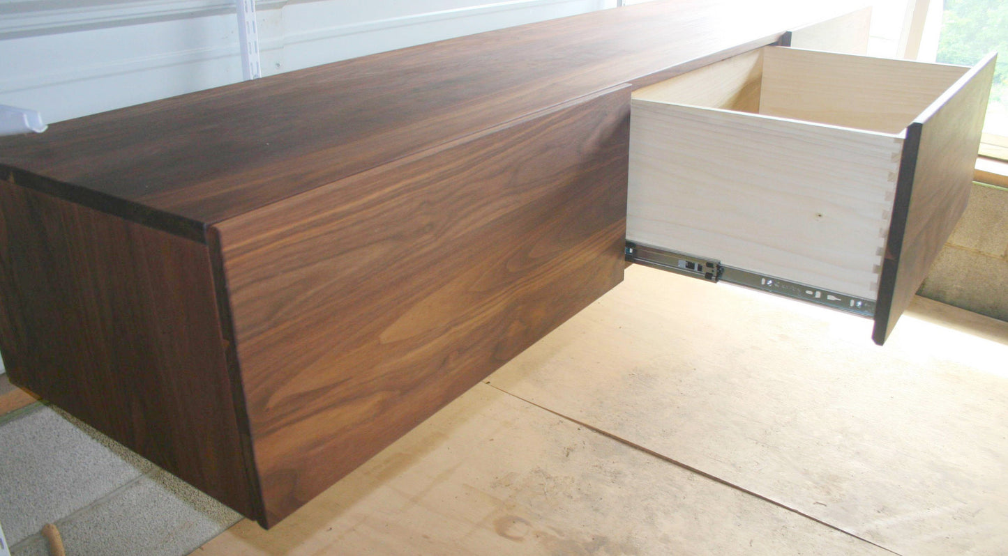 angled view three drawer wide hardwood furniture