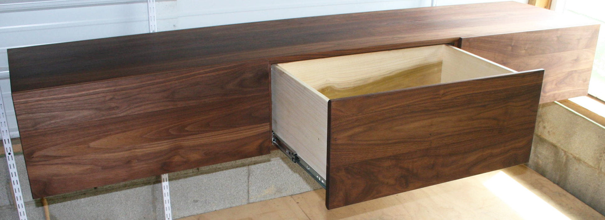 three drawer wide hardwood furniture with drawer open