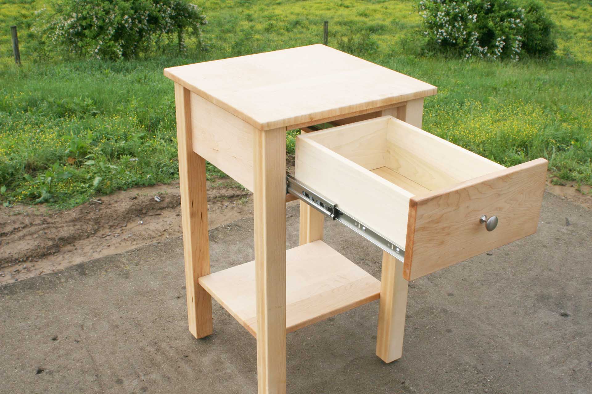 drawer open of nightstand with secret storage compartment