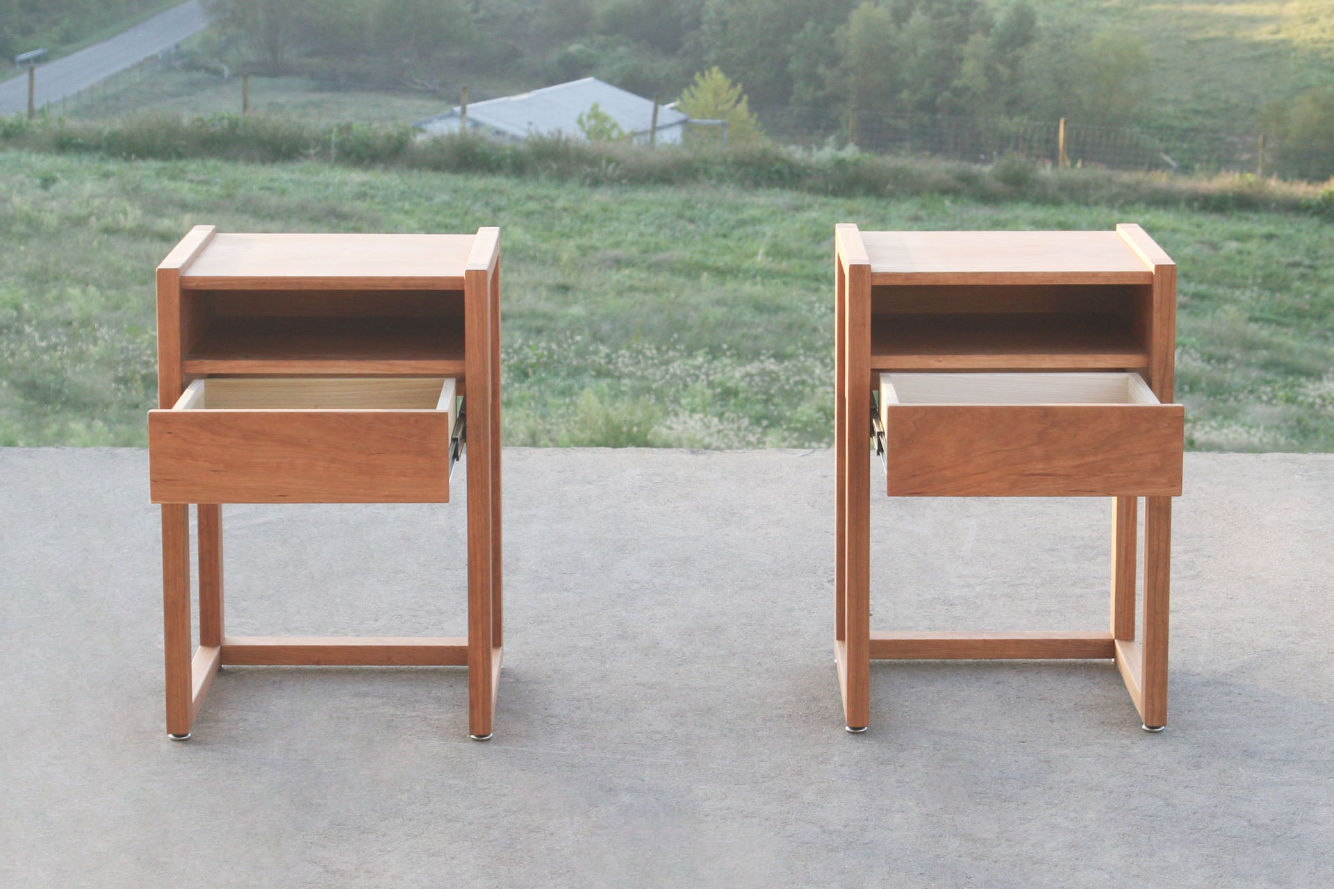 solid hardwood nightstand with shelves and open drawers front view