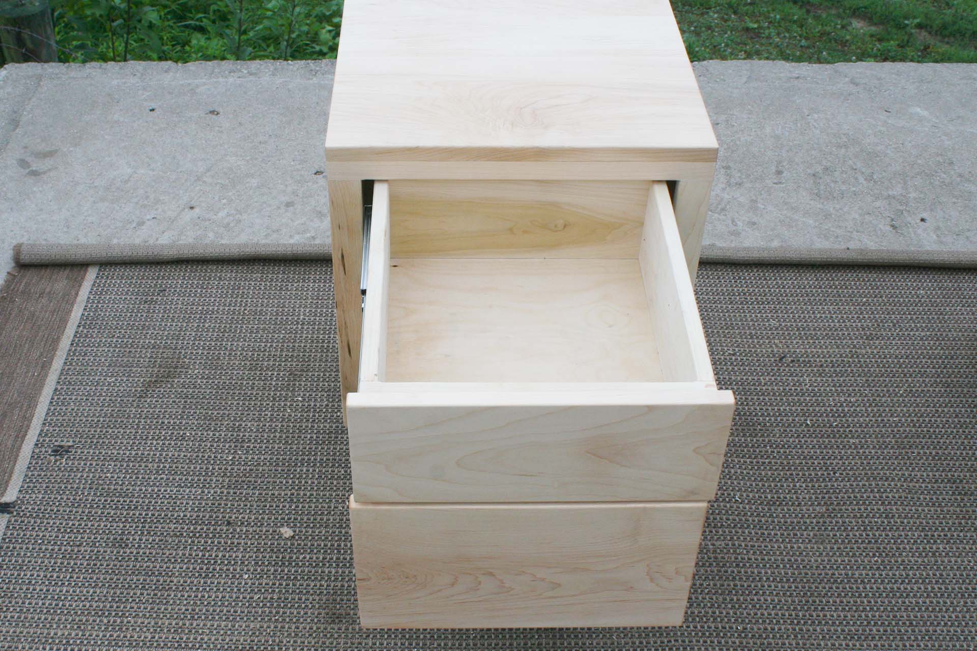 maple nightstand with drawers open