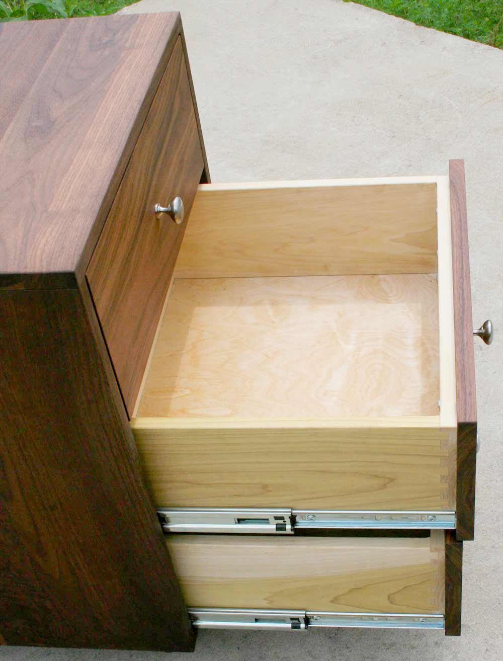 nightstand with drawers open side view