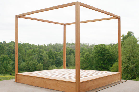 Modern canopy bed with wide platform and large rails