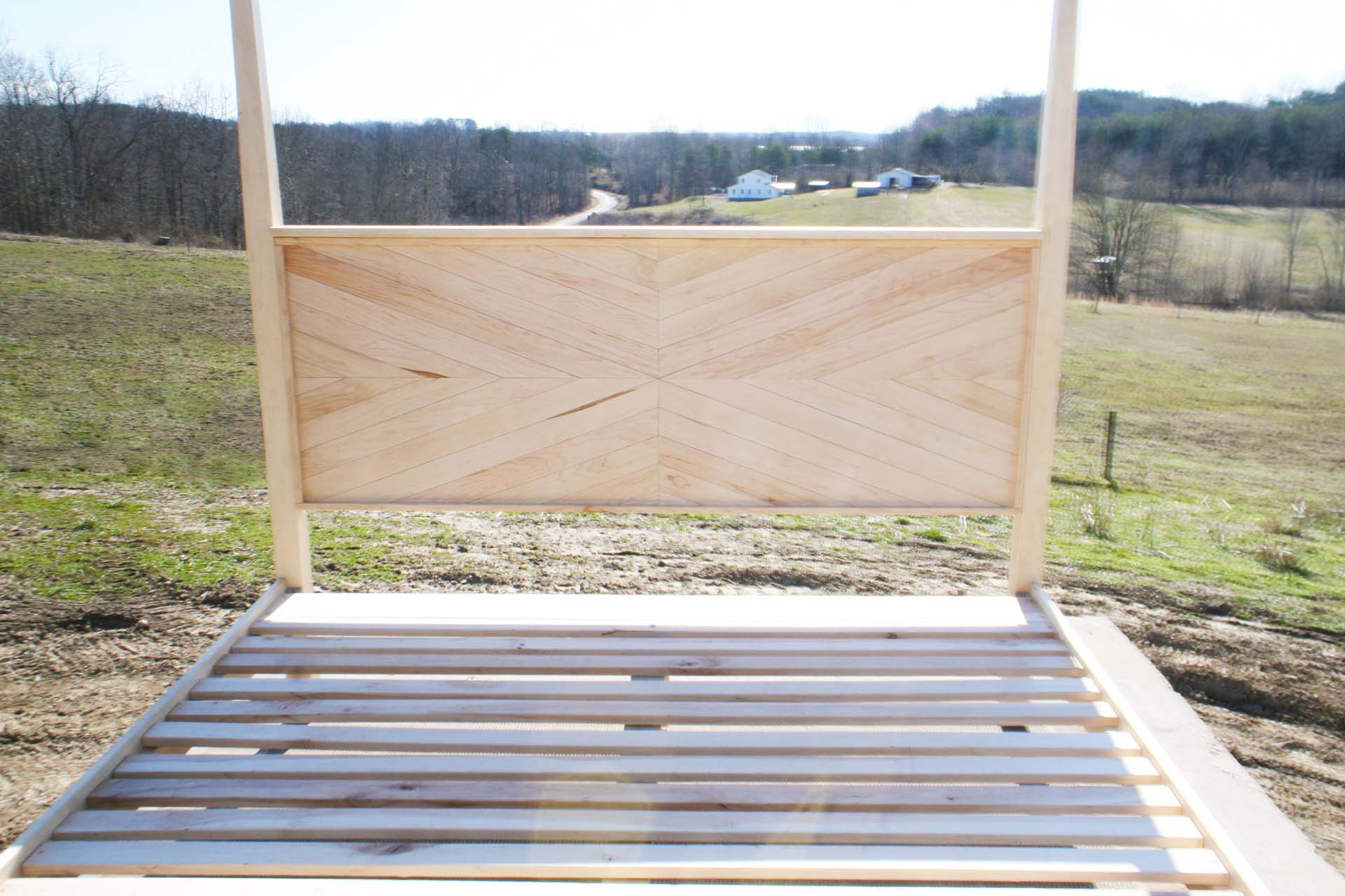 headboard of natural Canopy bed with tapered posts and headboard