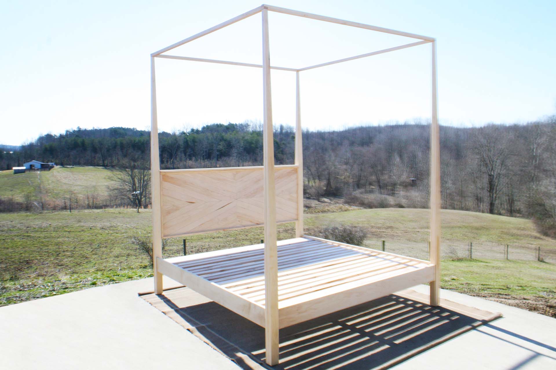 natural Canopy bed with tapered posts and headboard angled view