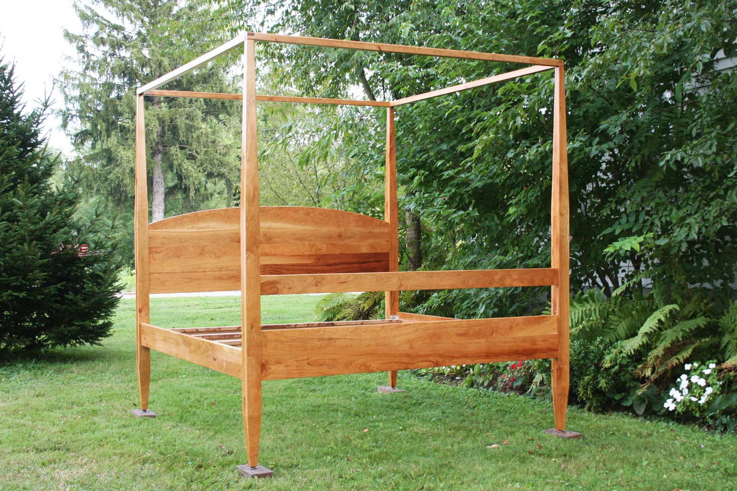 front angled view canopy bed with tall legs