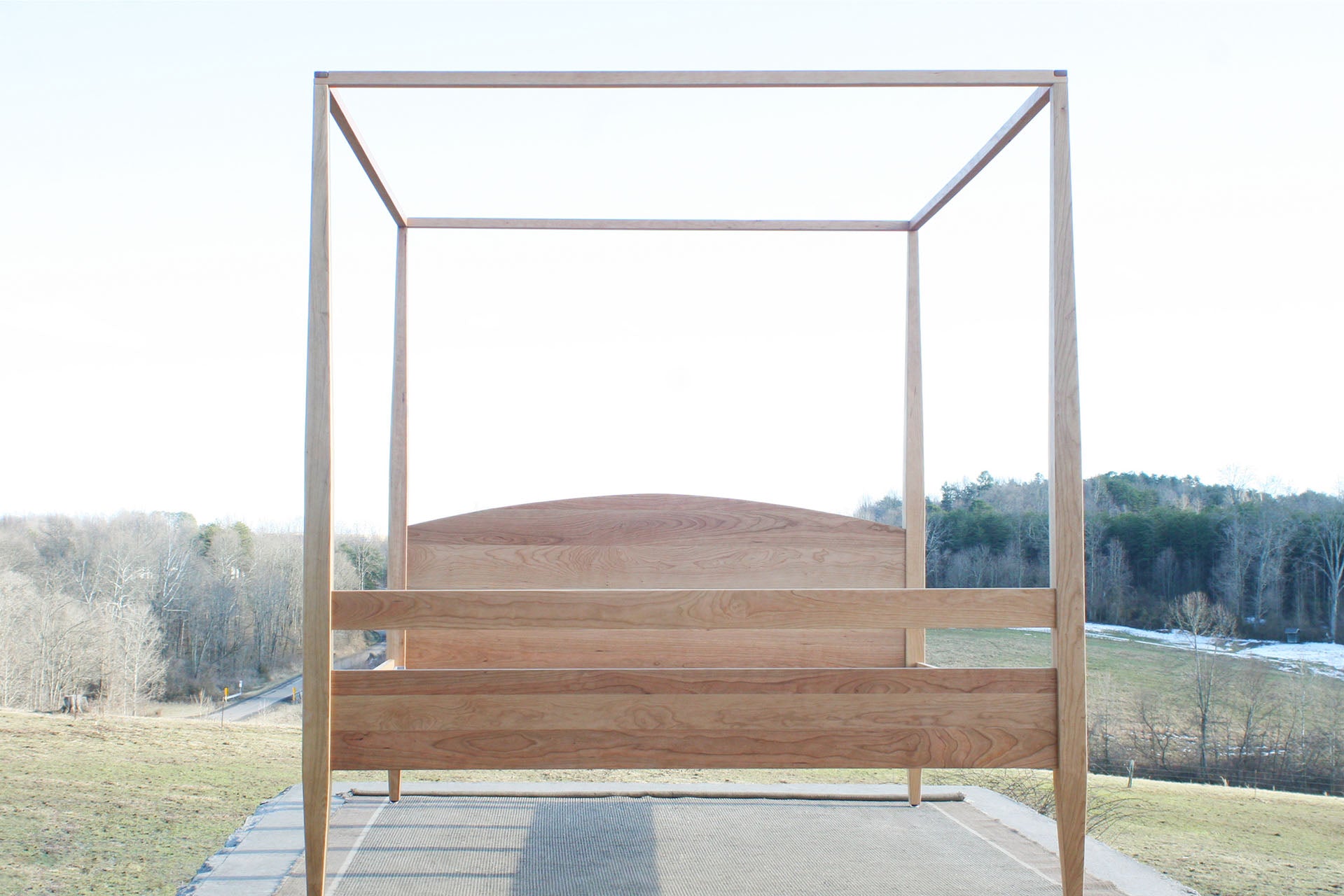 front view natural canopy bed with tall legs