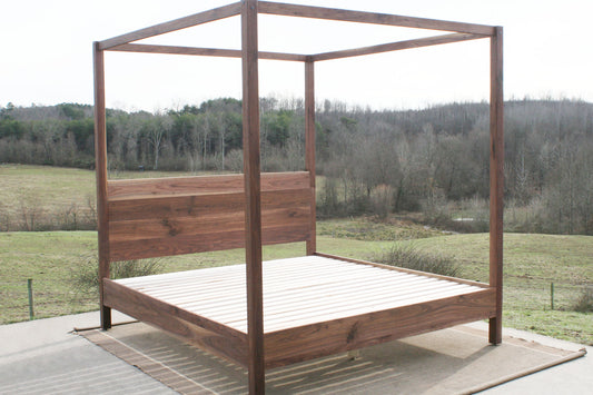 angled front view walnut canopy bed with square rails