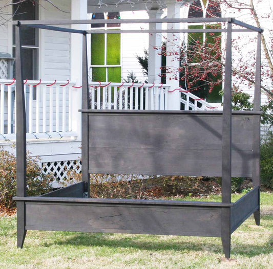 hardwood Canopy Bed with Sideboard Trim and Tapered Posts front view 