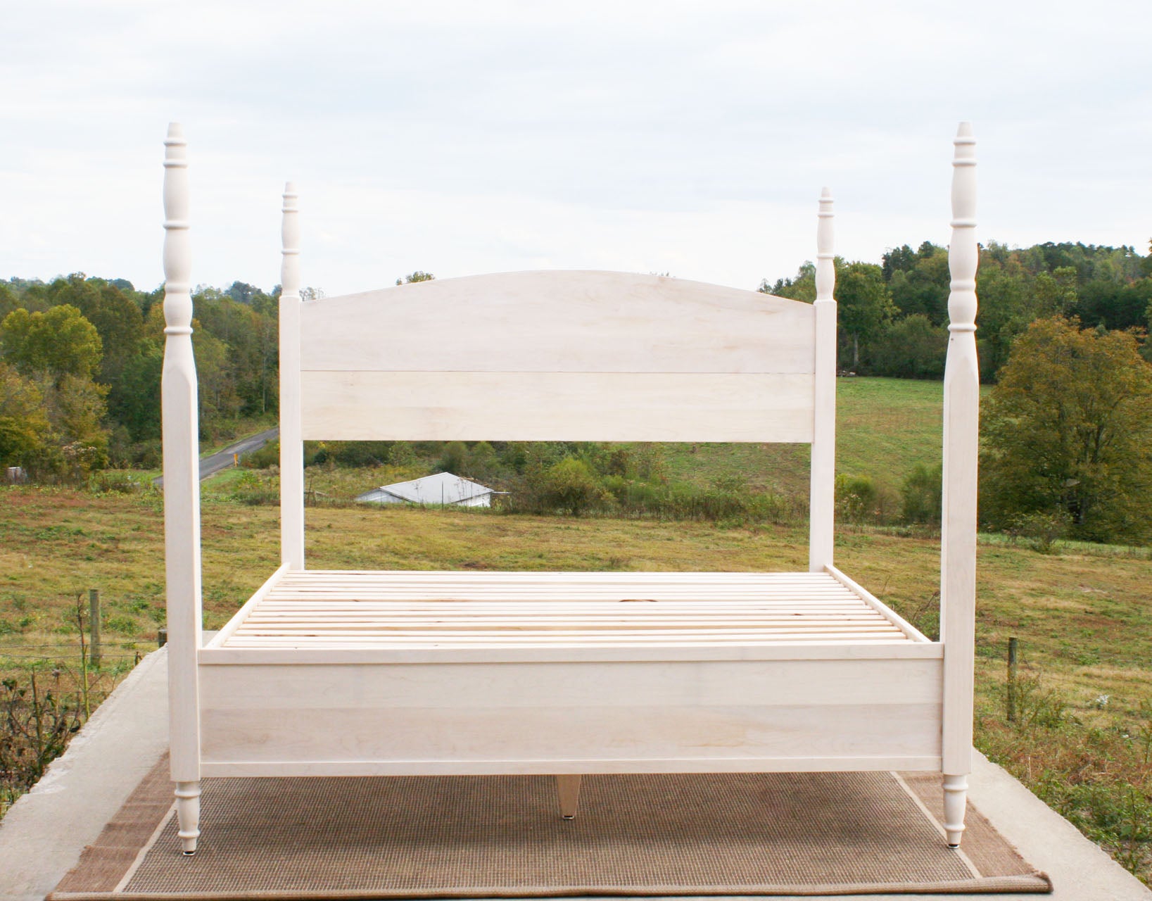 4 Poster bed with turned posts and arched headboard
