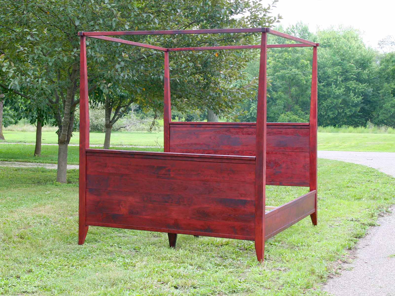 canopy bed with tall headboard and footboard front view