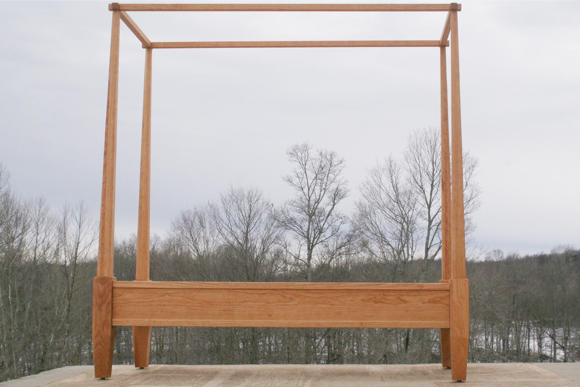 Canopy bed with tapered posts side view