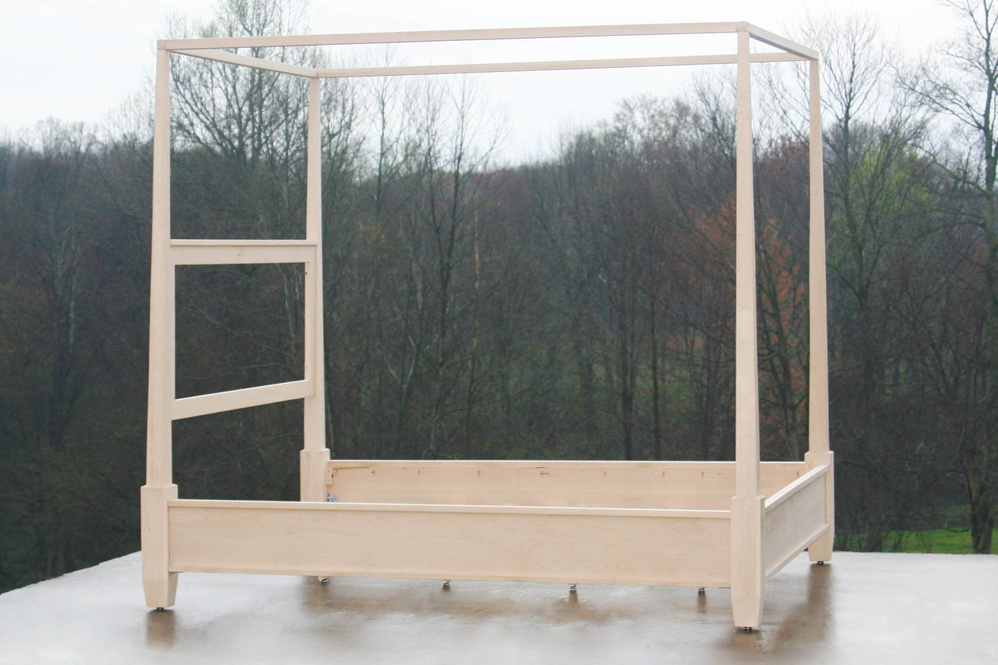 Canopy bed with block feet and tapered posts angled view