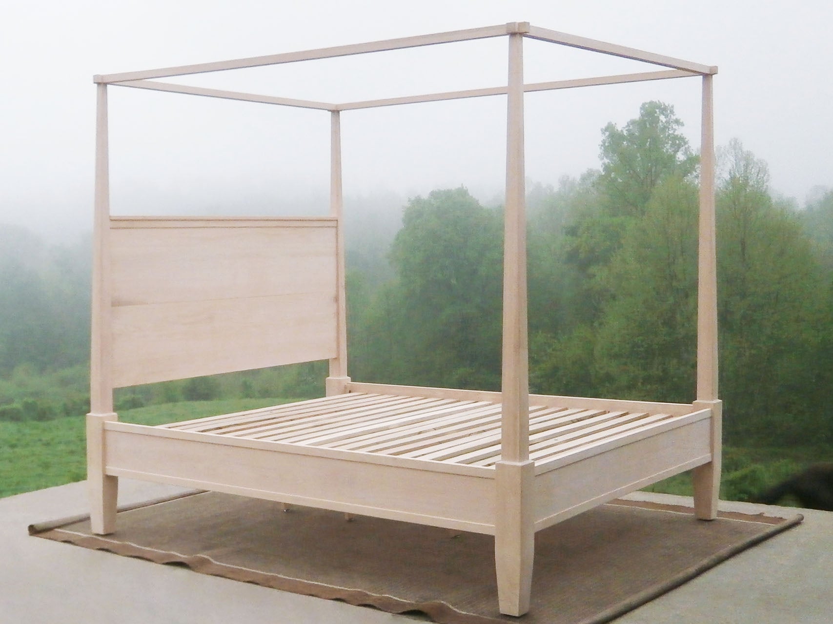 side angled view of solid natural heirloom Canopy Bed with straight posts and side rails