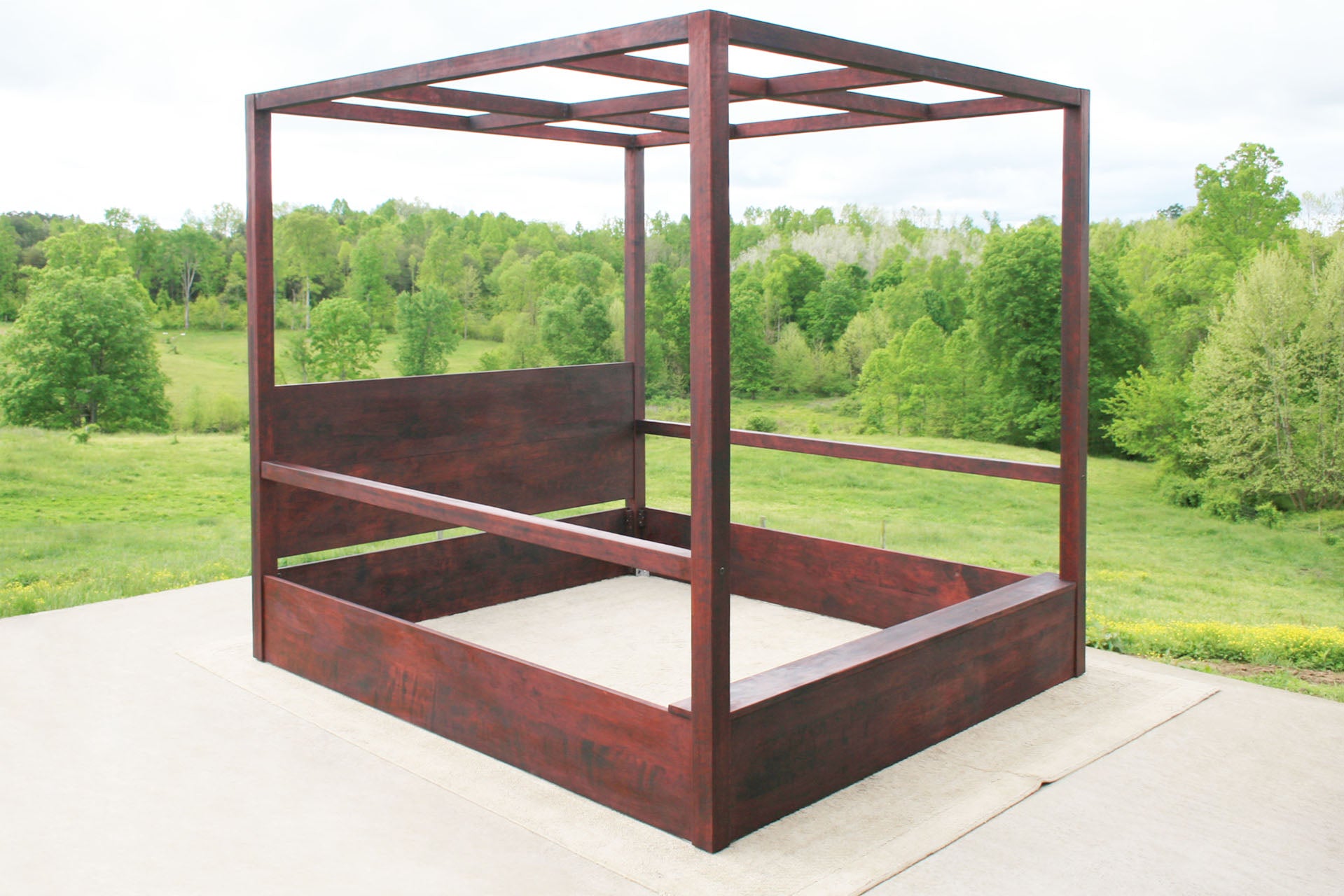 front side angled view of wood Canopy Bed with straight posts and side rails
