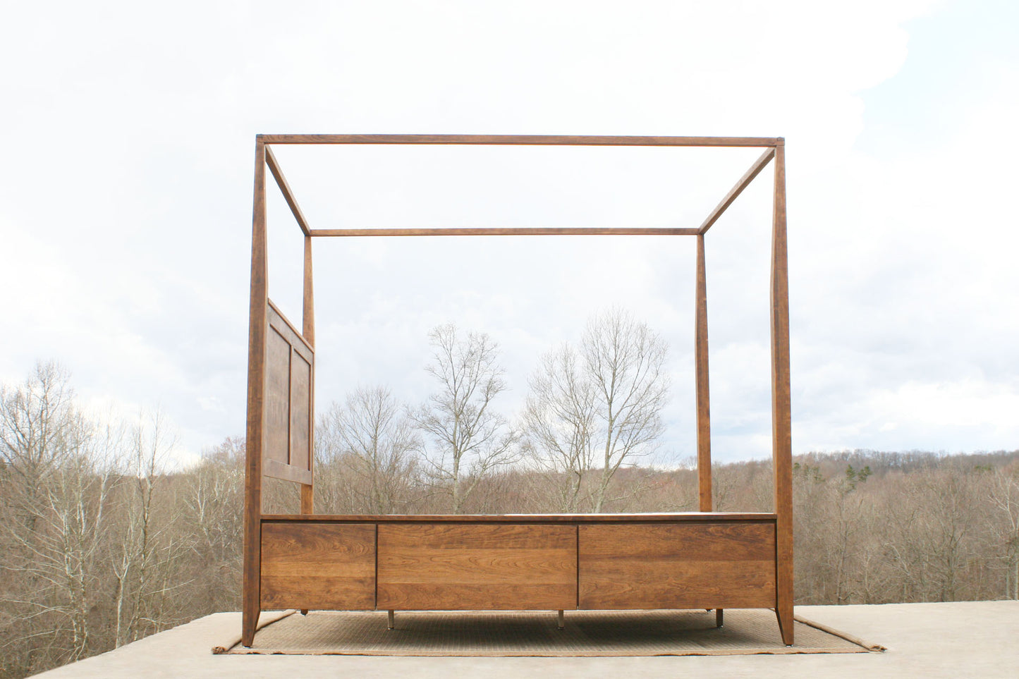 solid hardwood canopy bed with storage side view