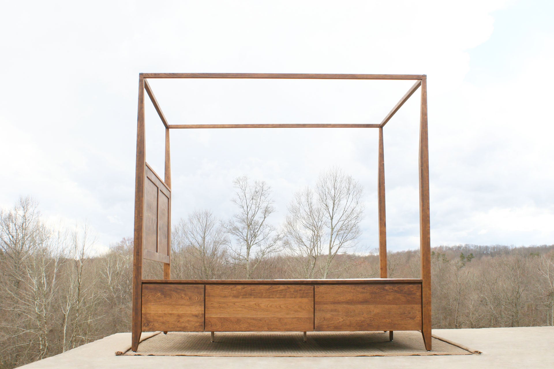 solid hardwood canopy bed with storage side view