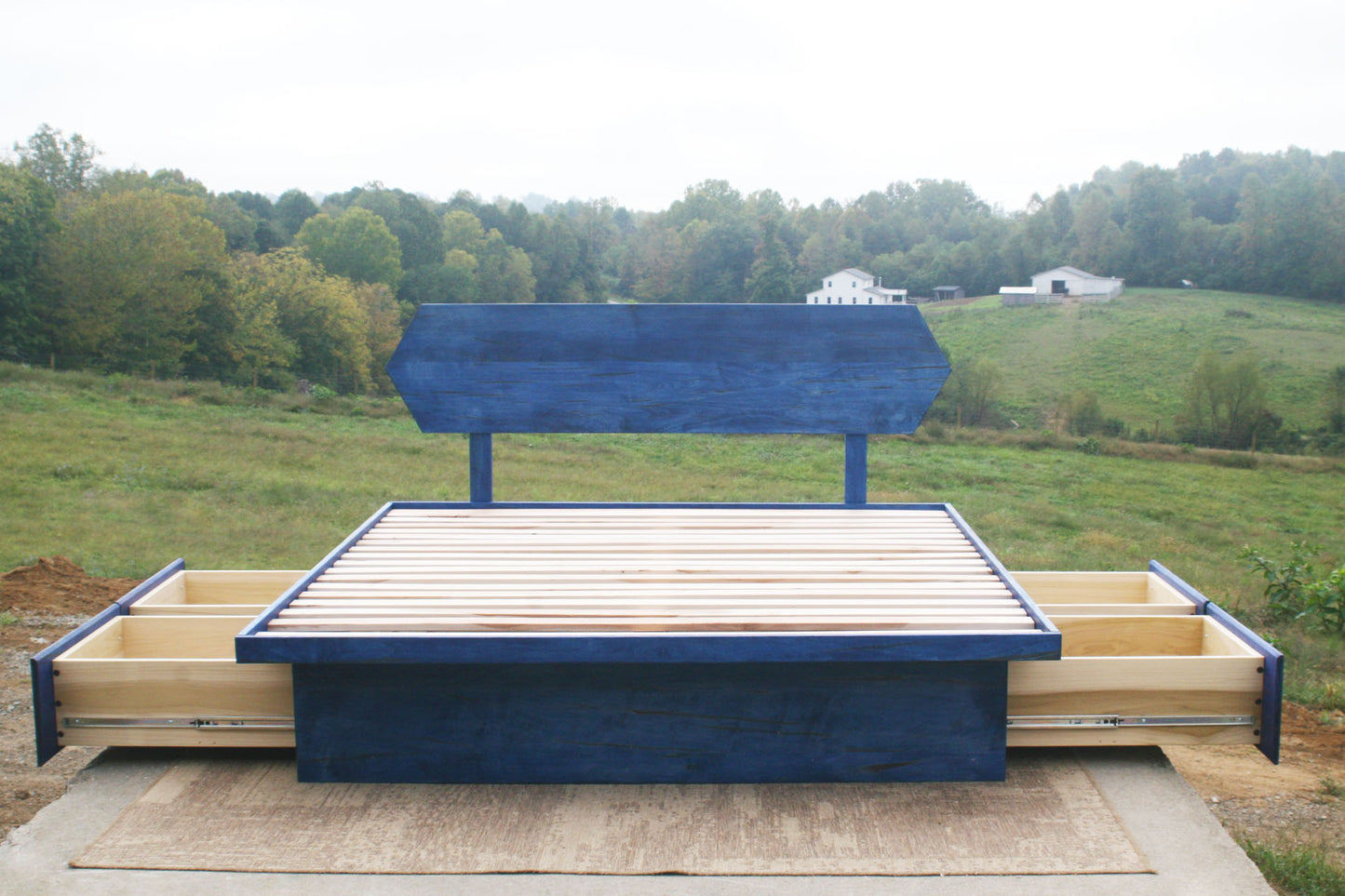 platform bed with 6 drawers with blue stain open drawers