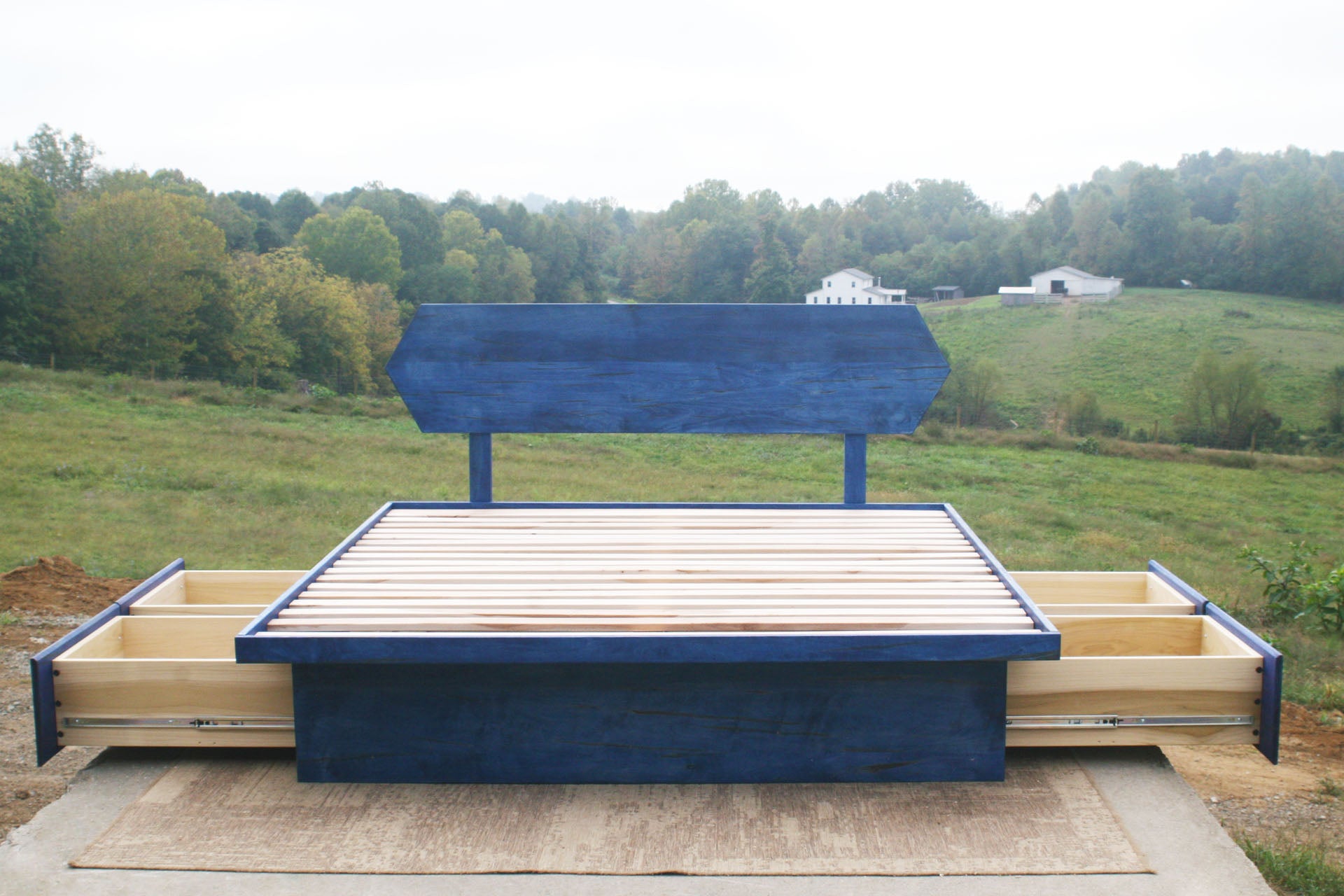 platform bed with 6 drawers with blue stain open drawers