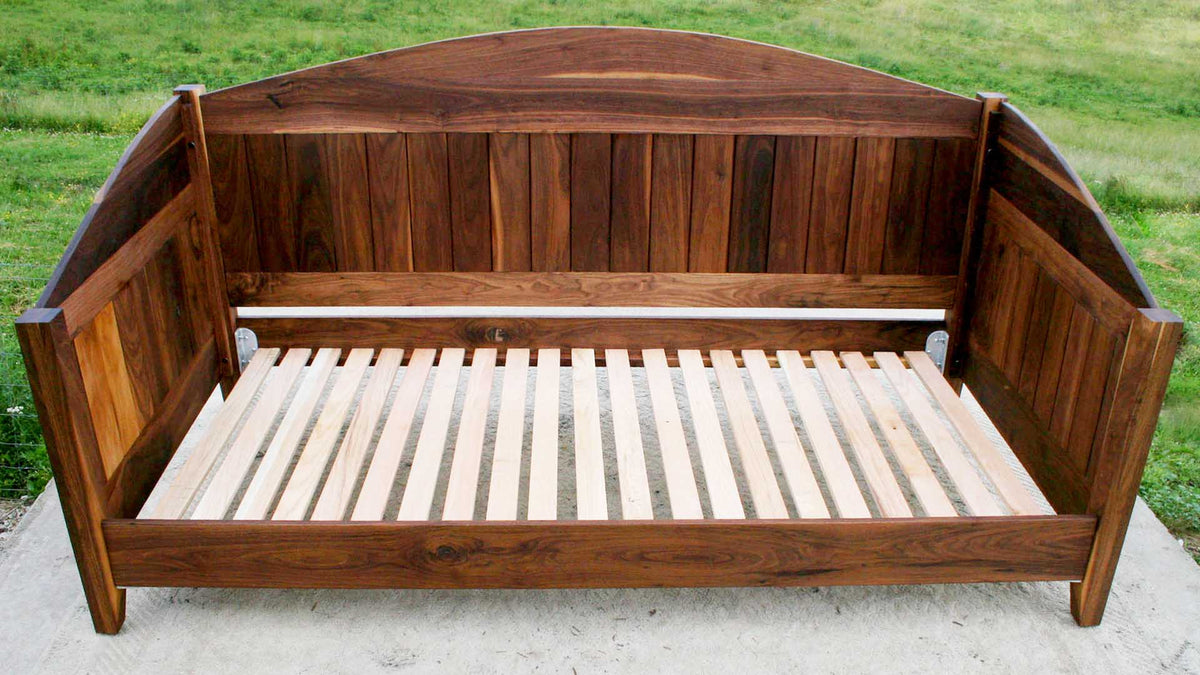 Day bed with arched back and sides top front view