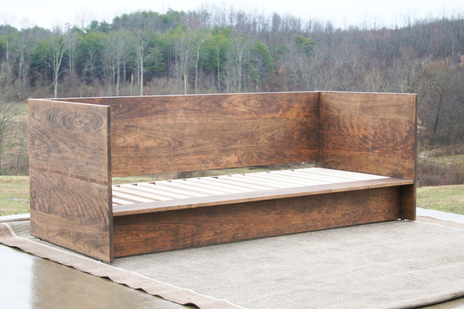 angled view natural Day Bed with a solid back and sides