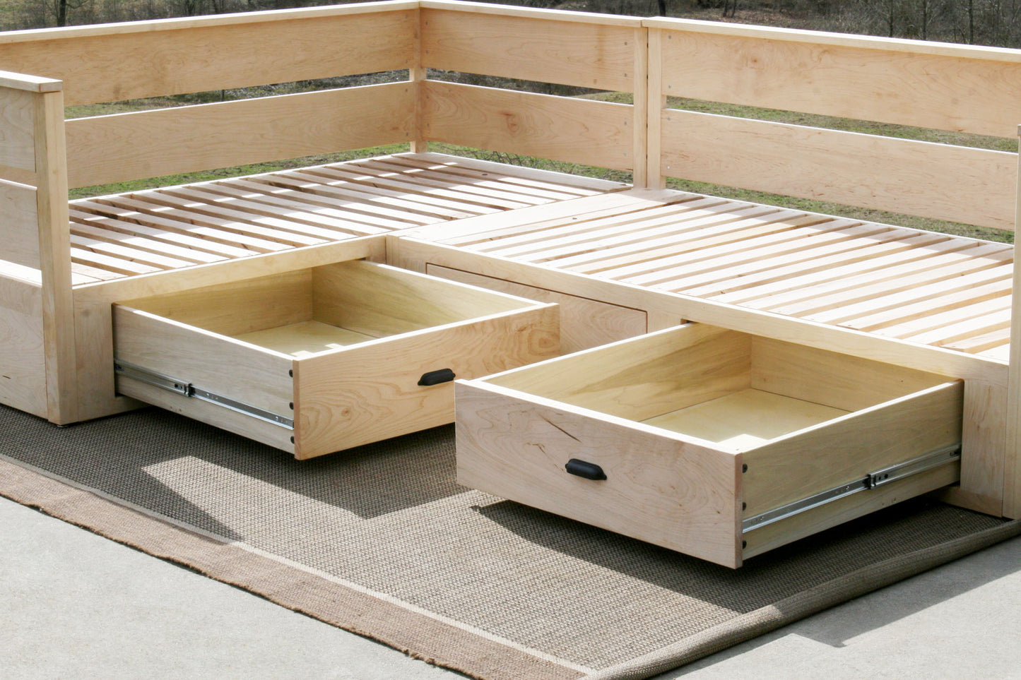 L shaped daybed with storage side view with drawers out