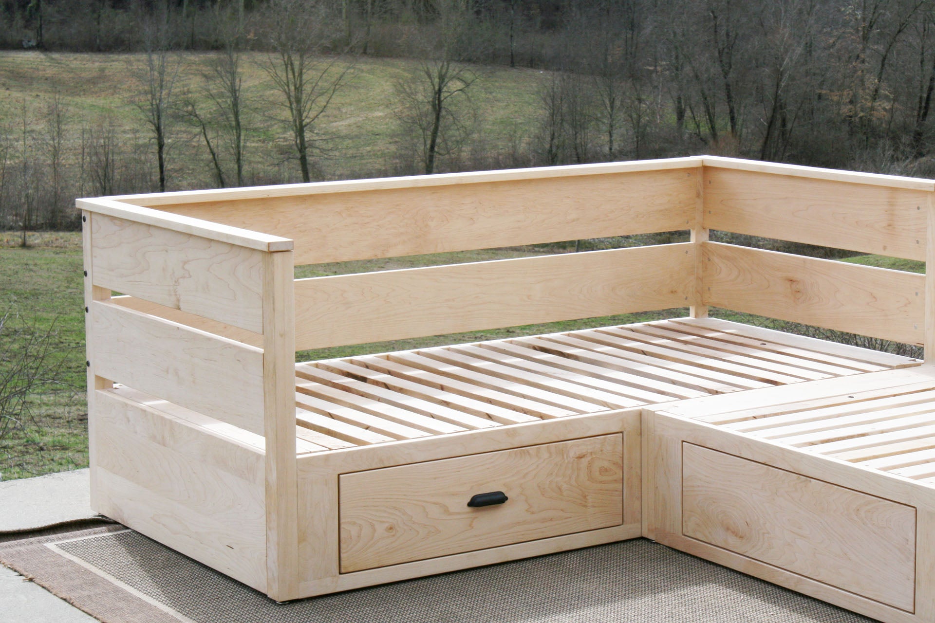 L shaped daybed with storage side view close up