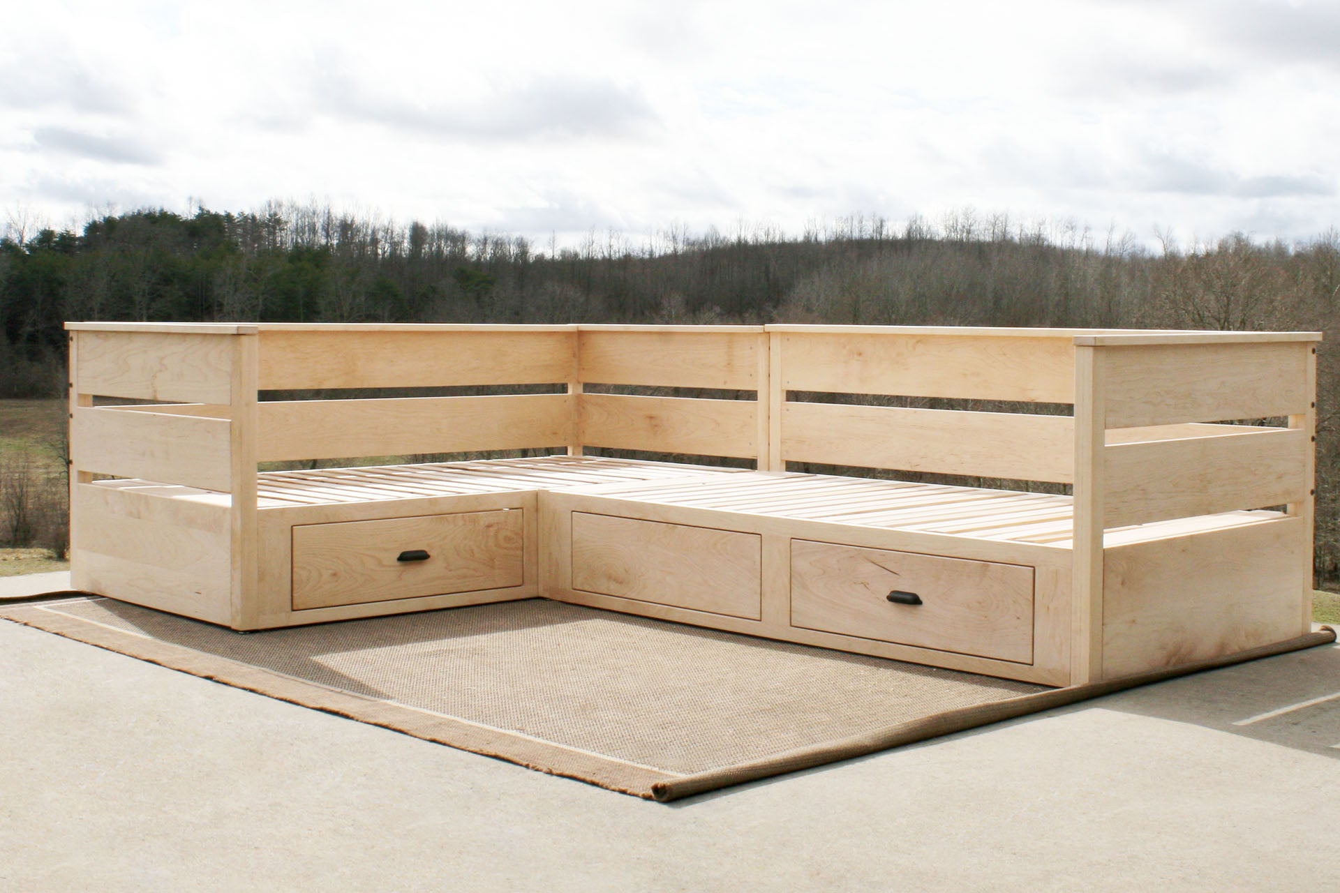 L shaped daybed with storage angled view natural