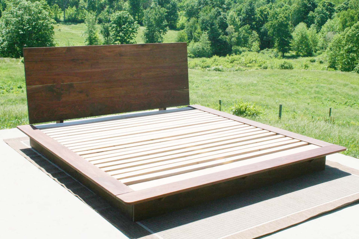 angled view walnut slanted headboard platform bed