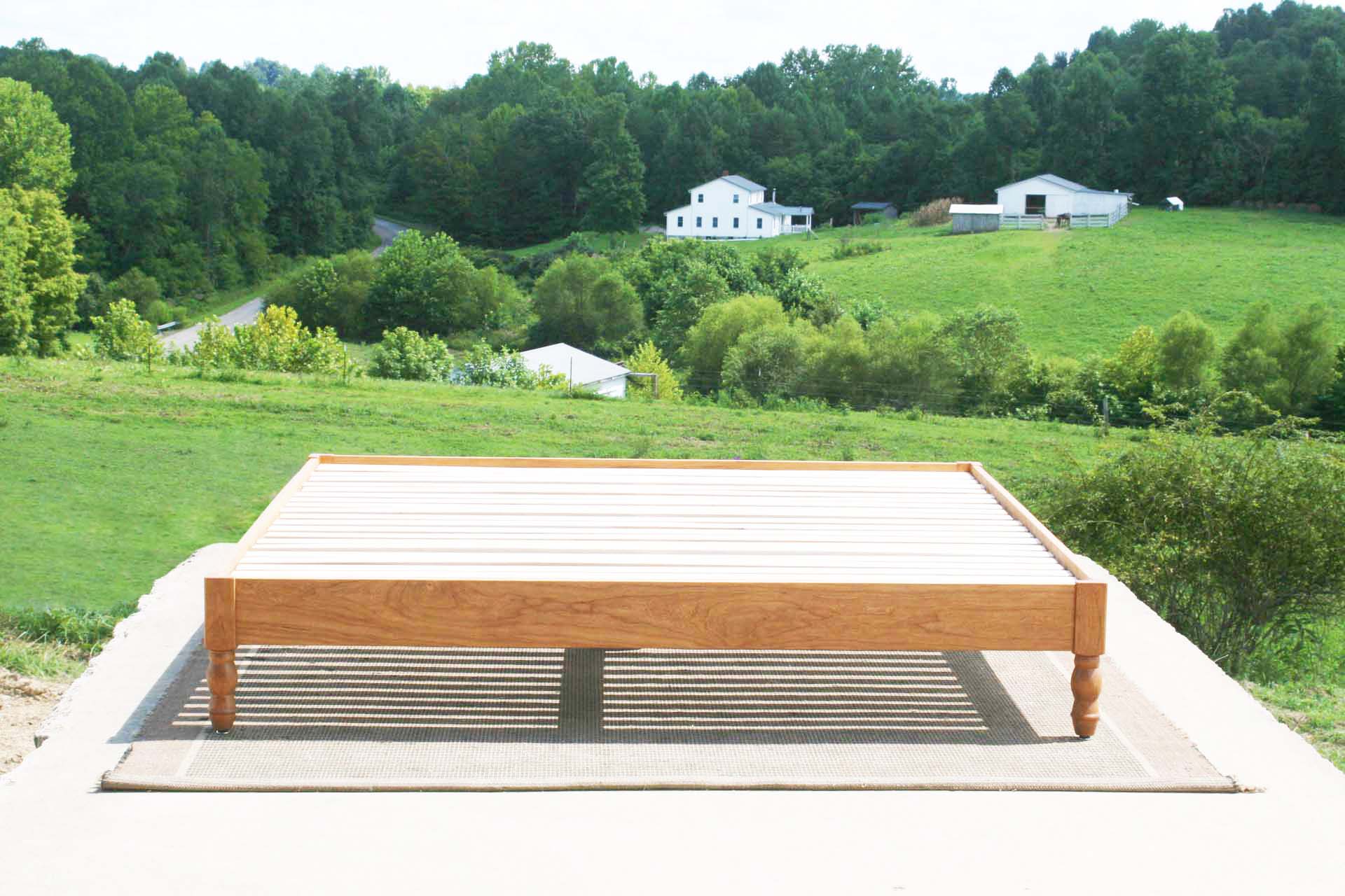front view close up platform bed with turned corner posts