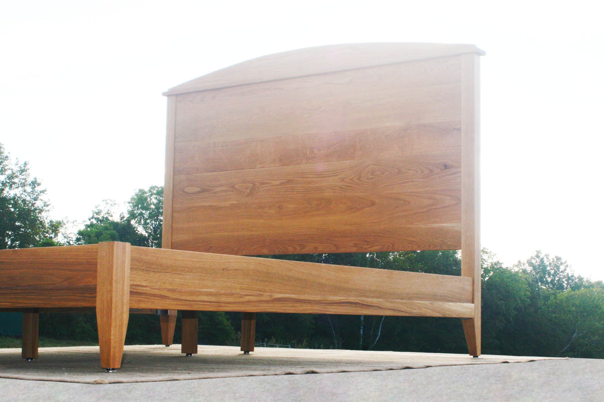 close up custom Platform bed with tall headboard