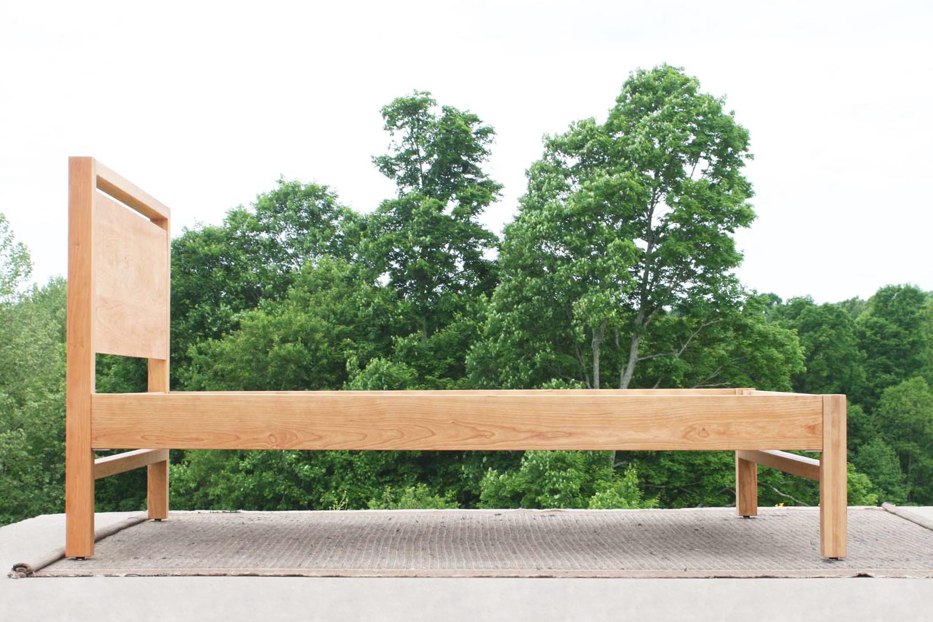 side view Modern platform bed with headboard