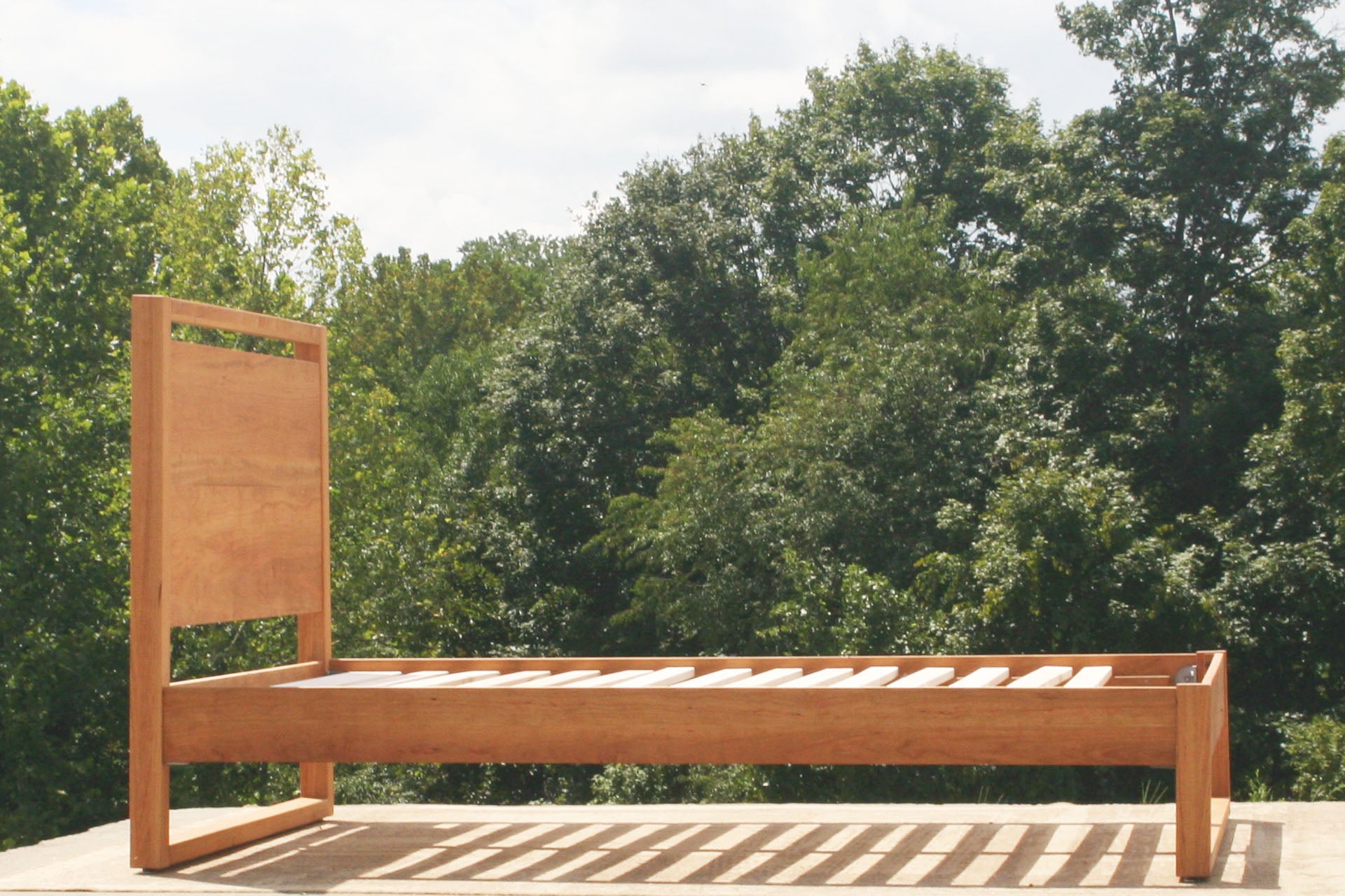 Modern platform bed with headboard side view