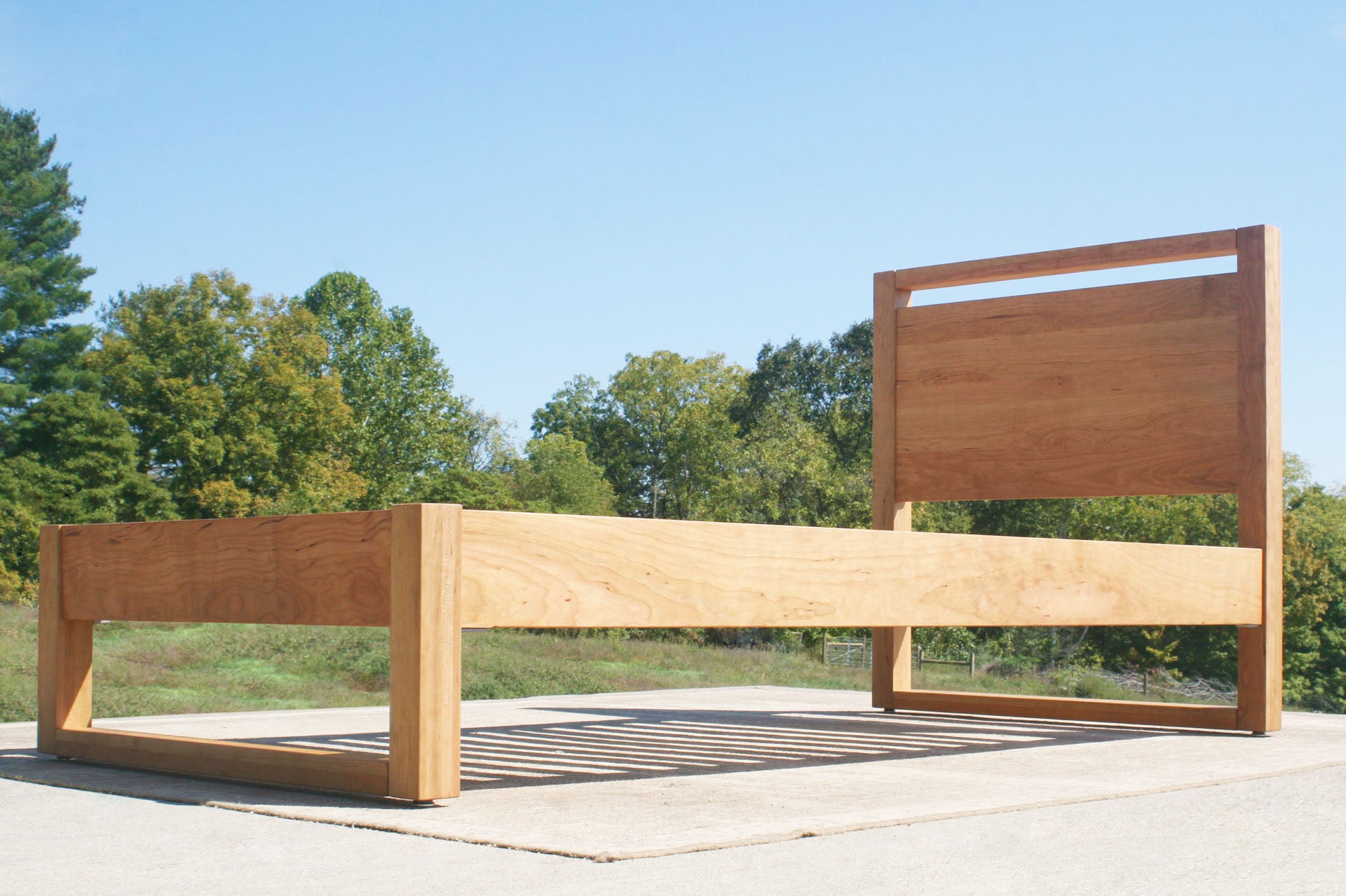 modern platform bed with headboard side angle