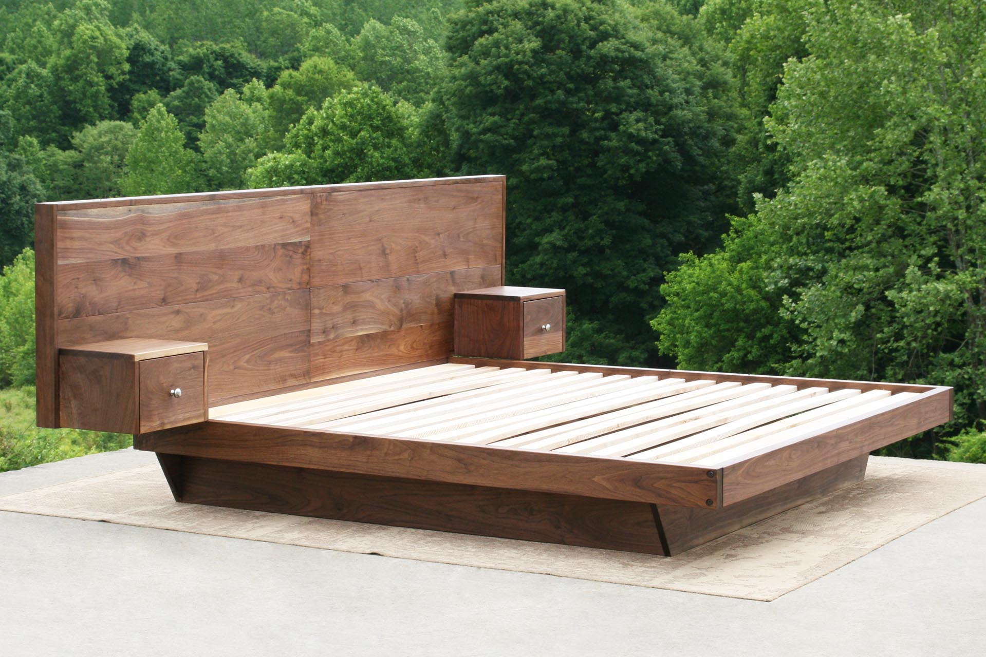 Floating platform bed with headboard and attached nightstands