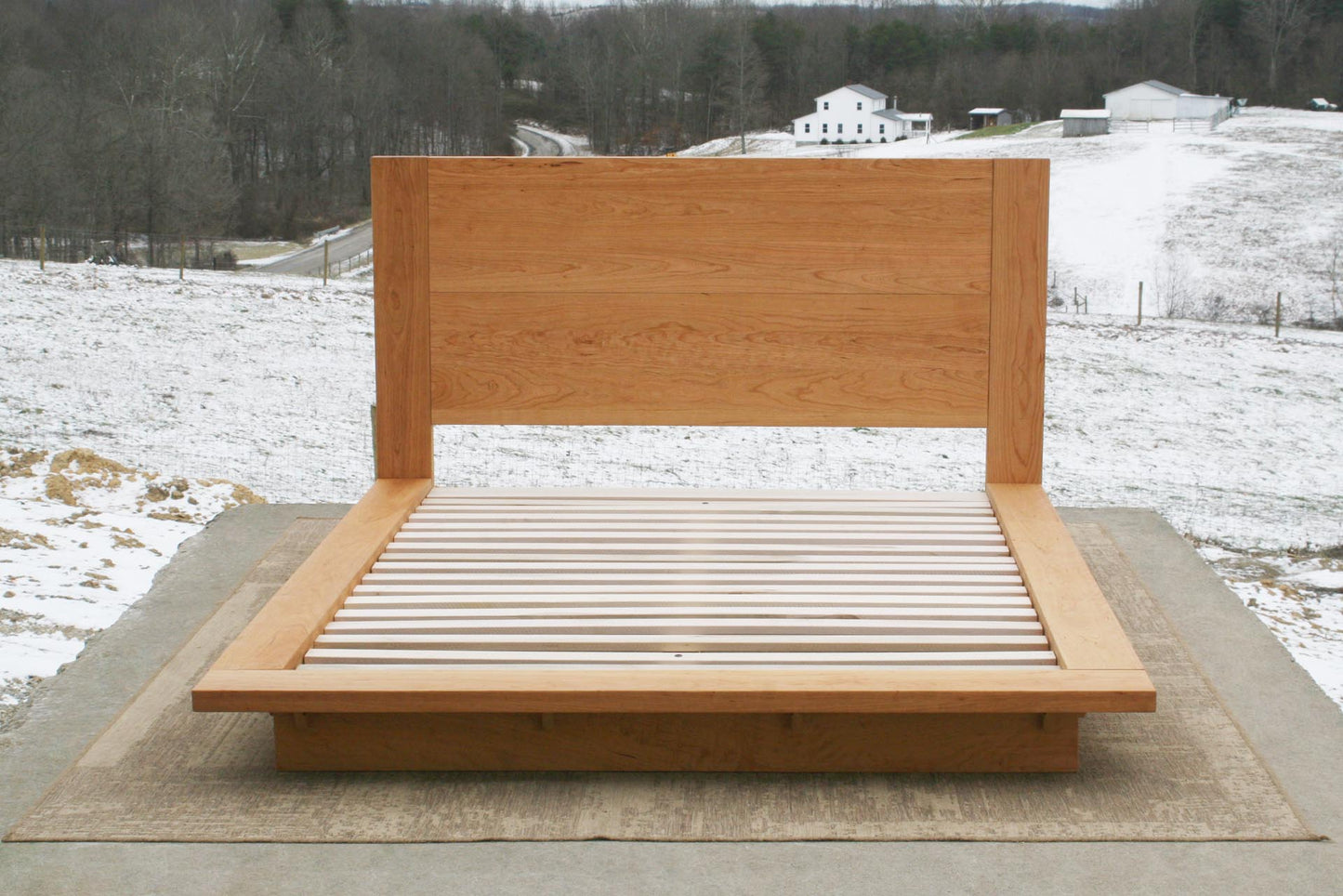 Platform bed with tall headboard front view