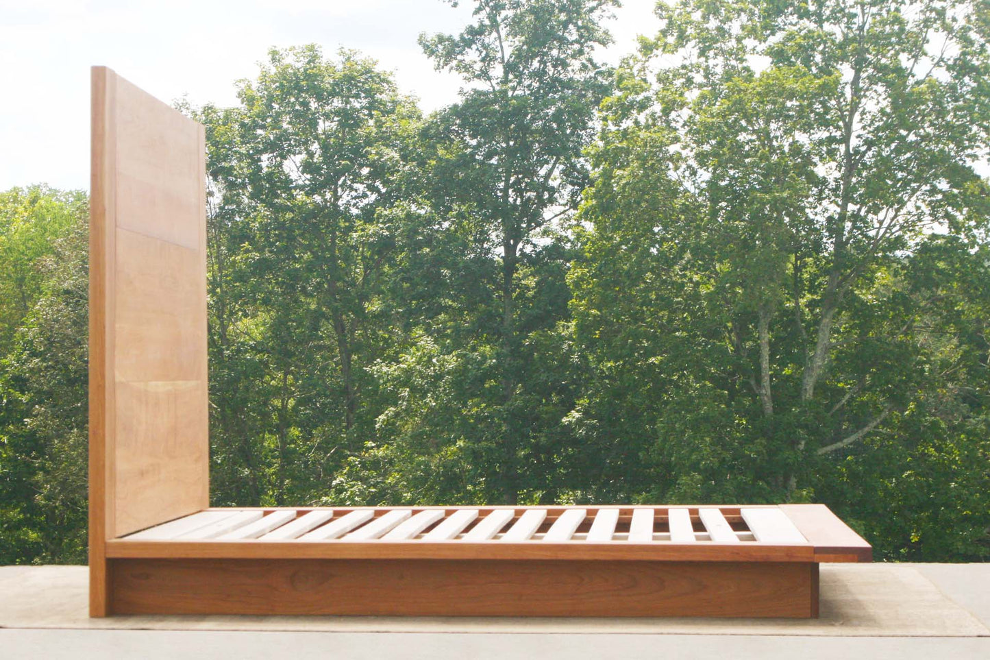 side view natural Platform bed with tall headboard