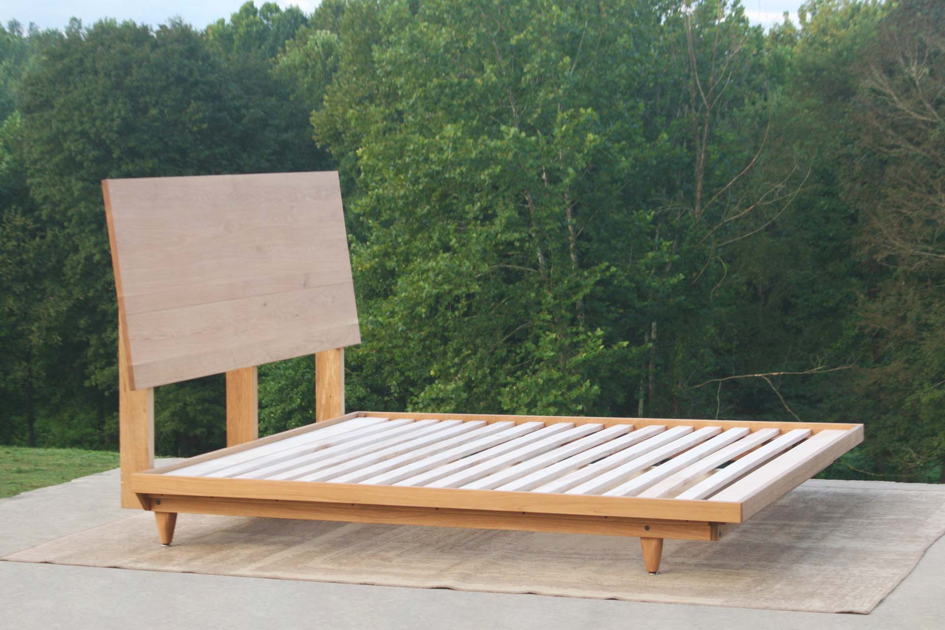 angled view natural walnut Mid Century Platform Bed with Slanted Headboard