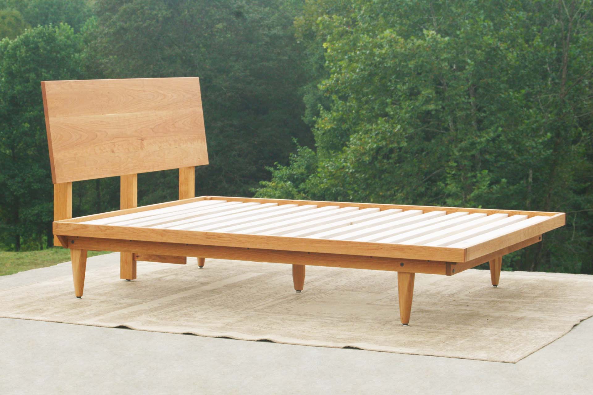 angled view natural Mid Century Platform Bed with Slanted Headboard
