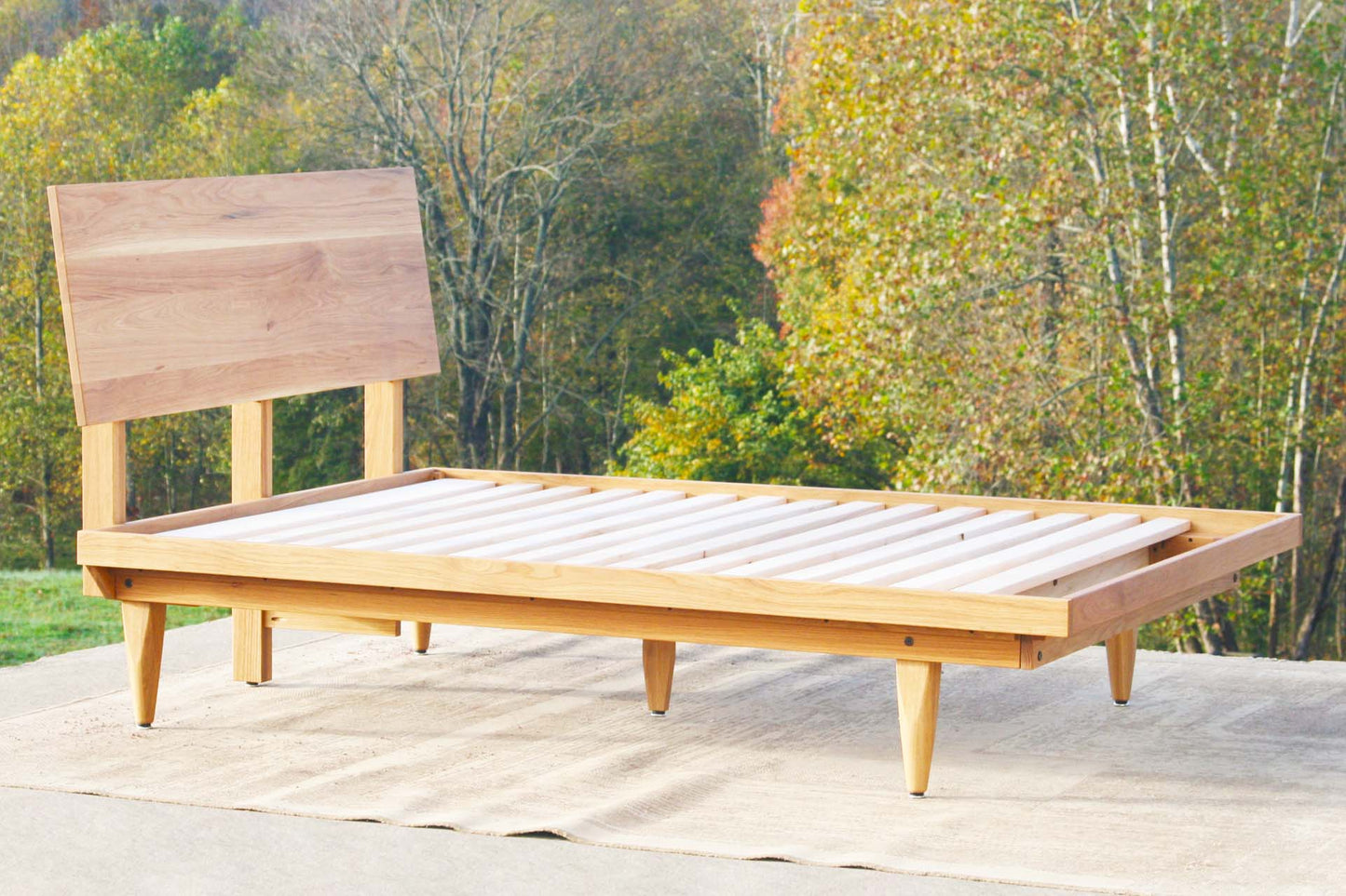 angled view custom Mid Century Platform Bed with Slanted Headboard